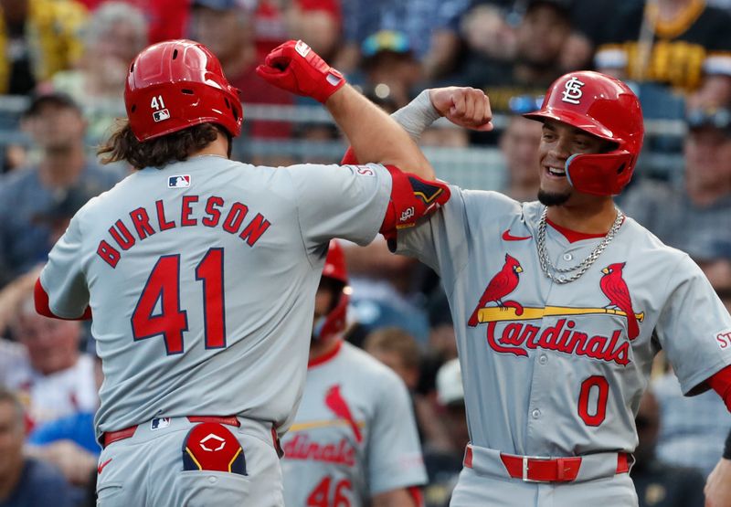 Jul 2, 2024; Pittsburgh, Pennsylvania, USA;  St. Louis Cardinals shortstop Masyn Winn (0) greets right fielder Alec Burleson (41) crossing home plate on a two-run home run against the Pittsburgh Pirates during the third inning at PNC Park. Mandatory Credit: Charles LeClaire-USA TODAY Sports