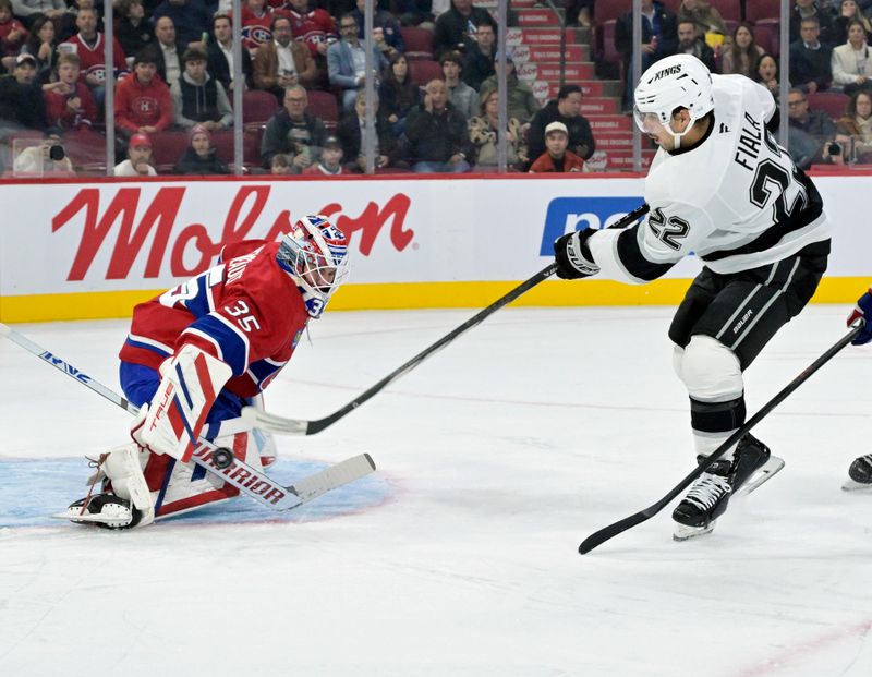 Oct 17, 2024; Montreal, Quebec, CAN; Montreal Canadiens goalie Sam Montembeault (35) makes a save against Los Angeles Kings forward Kevin Fiala (22) during the first period at the Bell Centre. Mandatory Credit: Eric Bolte-Imagn Images