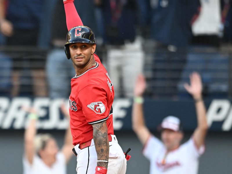 Sep 28, 2025; Cleveland, Ohio, USA;  Cleveland Guardians shortstop Brayan Rocchio (4) hits a three run home run to win the game in the tenth inning against the Texas Rangers at Progressive Field. Mandatory Credit: Ken Blaze-Imagn Images
