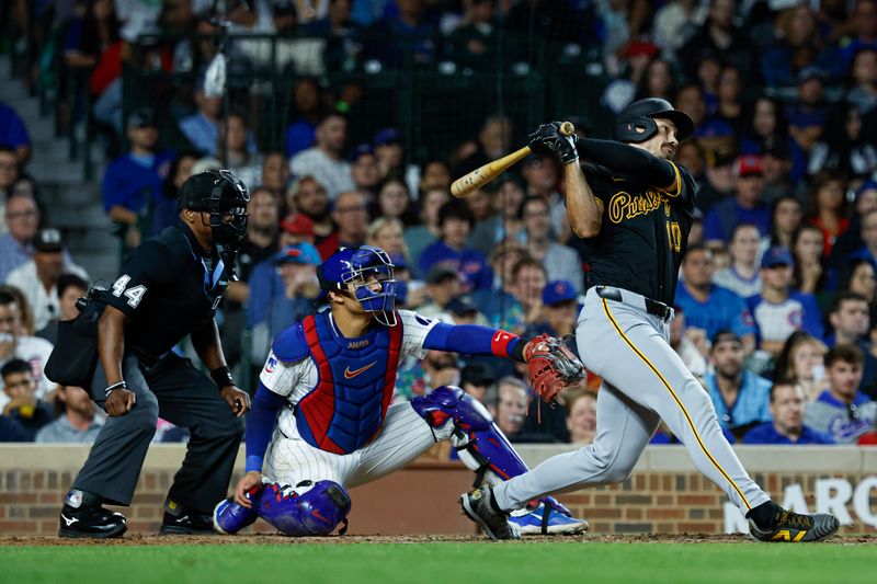 Sep 2, 2024; Chicago, Illinois, USA; Pittsburgh Pirates outfielder Bryan Reynolds (10) hits a three-run home run against the Chicago Cubs during the eight inning against the Chicago Cubs at Wrigley Field. Mandatory Credit: Kamil Krzaczynski-USA TODAY Sports