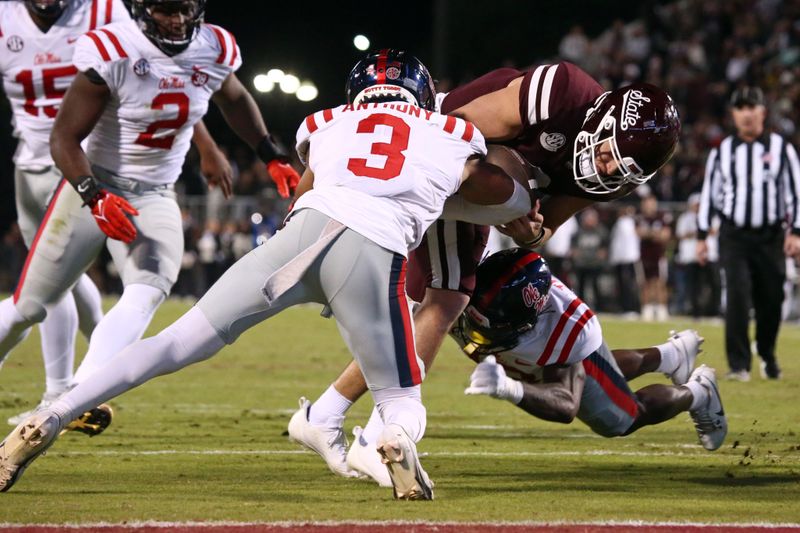 Nov 23, 2023; Starkville, Mississippi, USA; Mississippi State Bulldogs quarterback Will Rogers (2) runs the ball as Mississippi Rebels defensive backs Daijahn Anthony (3) and Ladarius Tennison (13) during the second half at Davis Wade Stadium at Scott Field. Mandatory Credit: Petre Thomas-USA TODAY Sports