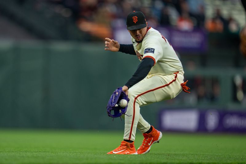May 12, 2025; San Francisco, California, USA; San Francisco Giants shortstop Willy Adames (2) fields a sharply hit ground ball against the Arizona Diamondbacks during the fourth inning at Oracle Park. Mandatory Credit: Neville E. Guard-Imagn Images