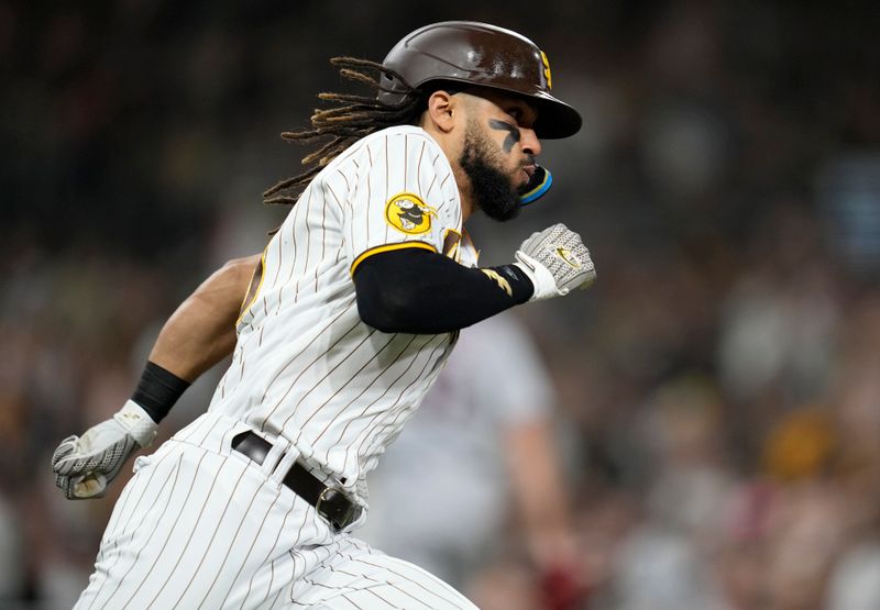 Jun 14, 2023; San Diego, California, USA;  San Diego Padres right fielder Fernando Tatis Jr. (23) hits a double against the Cleveland Guardians during the sixth inning at Petco Park. Mandatory Credit: Ray Acevedo-USA TODAY Sports