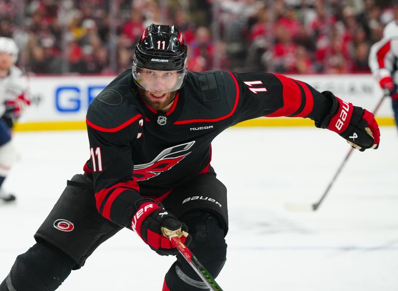 May 12, 2025; Raleigh, North Carolina, USA; Carolina Hurricanes center Jordan Staal (11) skates against the Washington Capitals during the third period in game four of the second round of the 2025 Stanley Cup Playoffs at Lenovo Center. Mandatory Credit: James Guillory-Imagn Images