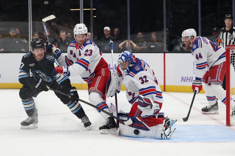 Nov 22, 2025; Salt Lake City, Utah, USA;New York Rangers goaltender Jonathan Quick (32) blocks a shot by the Utah Mammoth during the first period at Delta Center. Mandatory Credit: Rob Gray-Imagn Images