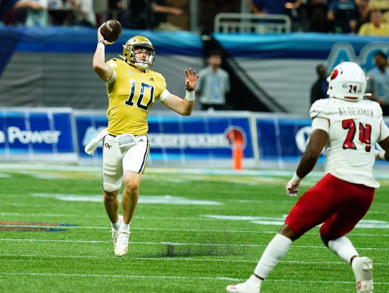 Sep 1, 2023; Atlanta, Georgia, USA; Georgia Tech Yellow Jackets quarterback Haynes King (10) rolls out to pass against the Louisville Cardinals during the second half at Mercedes-Benz Stadium. Mandatory Credit: John David Mercer-USA TODAY Sports