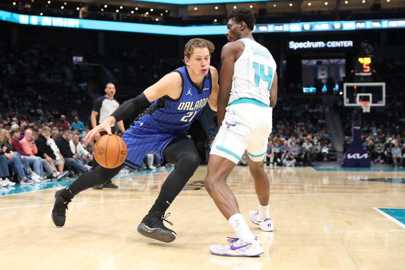 CHARLOTTE, NC -NOVEMBER 25: Moritz Wagner #21 of the Orlando Magic dribbles the ball  during the game against the Charlotte Hornets on November 25, 2024 at Spectrum Center in Charlotte, North Carolina. NOTE TO USER: User expressly acknowledges and agrees that, by downloading and or using this photograph, User is consenting to the terms and conditions of the Getty Images License Agreement. Mandatory Copyright Notice: Copyright 2024 NBAE (Photo by Brock Williams-Smith/NBAE via Getty Images)