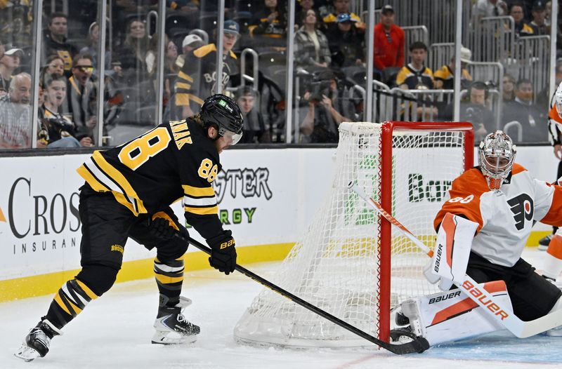 Sep 29, 2025; Boston, Massachusetts, USA;  Boston Bruins right wing David Pastrnak (88) shoots the puck against Philadelphia Flyers goaltender Dan Vladar (80) during the first period at TD Garden. Mandatory Credit: Eric Canha-Imagn Images