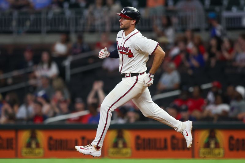 Aug 6, 2024; Atlanta, Georgia, USA; Atlanta Braves first baseman Matt Olson (28) hits a double against the Milwaukee Brewers in the seventh inning at Truist Park. Mandatory Credit: Brett Davis-USA TODAY Sports
