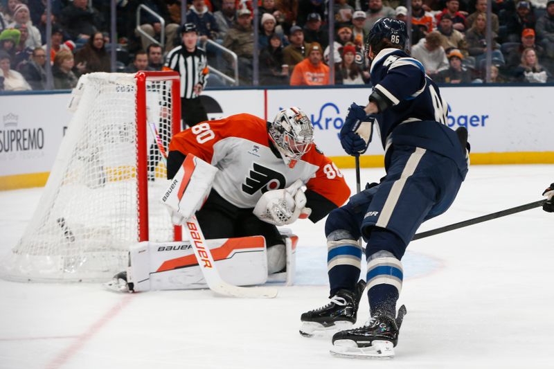 Jan 28, 2026; Columbus, Ohio, USA; Philadelphia Flyers goalie Dan Vladar (80) makes a save on the shot attempt of Columbus Blue Jackets right wing Kirill Marchenko (86) during the second period at Nationwide Arena. Mandatory Credit: Russell LaBounty-Imagn Images