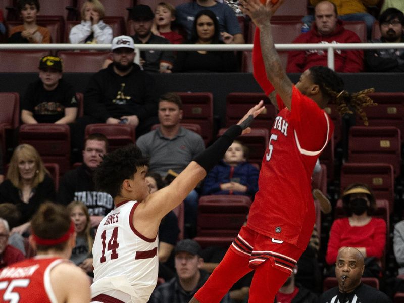 Jan 14, 2024; Stanford, California, USA; Utah Utes guard Deivon Smith (5) shoots a fadeaway jumper of Stanford Cardinal forward Spencer Jones (14) during the second half at Maples Pavilion. Mandatory Credit: D. Ross Cameron-USA TODAY Sports