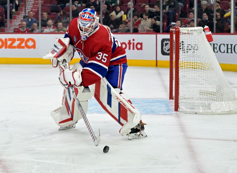 Nov 7, 2023; Montreal, Quebec, CAN; Montreal Canadiens goalie Sam Montembeault (35) plays the puck during the second period of the game against the Tampa Bay Lightning at the Bell Centre. Mandatory Credit: Eric Bolte-USA TODAY Sports