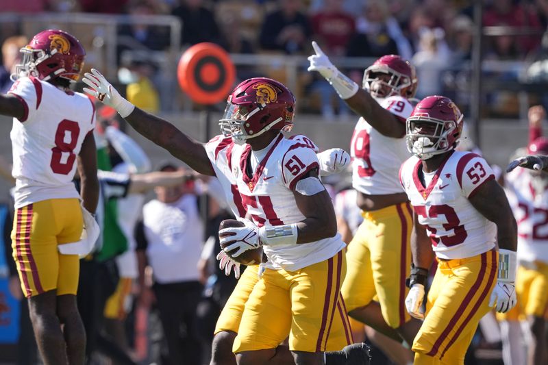 Oct 28, 2023; Berkeley, California, USA; USC Trojans defensive end Solomon Byrd (51) celebrates with teammates after recovering a fumble during the first quarter at California Memorial Stadium. Mandatory Credit: Darren Yamashita-USA TODAY Sports
