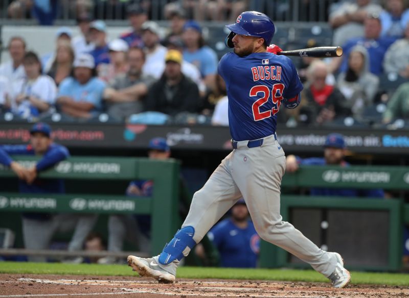 Apr 29, 2025; Pittsburgh, Pennsylvania, USA;  Chicago Cubs first baseman Michael Busch (29) hits a single against the Pittsburgh Pirates during the fourth inning at PNC Park. Mandatory Credit: Charles LeClaire-Imagn Images