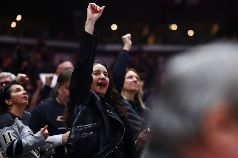 Dec 23, 2023; Los Angeles, California, USA; An Los Angeles Kings fan celebrates a goal by Los Angeles Kings right wing Quinton Byfield (55) against the Calgary Flames during the first period at Crypto.com Arena. Mandatory Credit: Jessica Alcheh-USA TODAY Sports