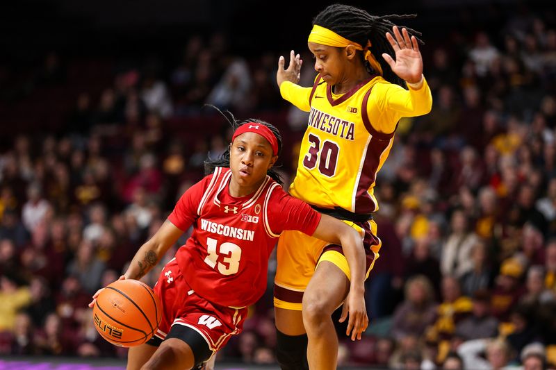 Feb 20, 2024; Minneapolis, Minnesota, USA; Wisconsin Badgers guard Ronnie Porter (13) works around Minnesota Golden Gophers guard Janay Sanders (30) during the second half at Williams Arena. Mandatory Credit: Matt Krohn-USA TODAY Sports