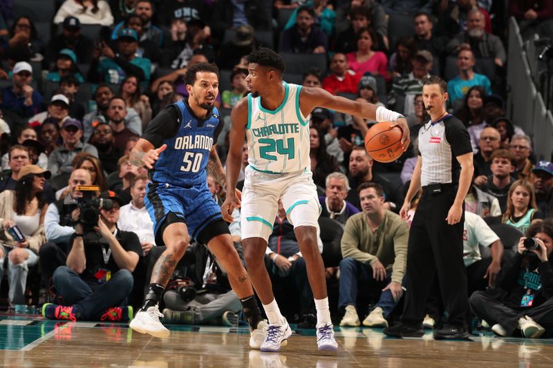 CHARLOTTE, NC - NOVEMBER 25:   Brandon Miller #24 of the Charlotte Hornets posts up against Cole Anthony #50 of the Orlando Magic during a regular season game on November 25, 2024 at Spectrum Center in Charlotte, North Carolina. NOTE TO USER: User expressly acknowledges and agrees that, by downloading and or using this photograph, User is consenting to the terms and conditions of the Getty Images License Agreement. Mandatory Copyright Notice: Copyright 2024 NBAE (Photo by Kent Smith/NBAE via Getty Images)