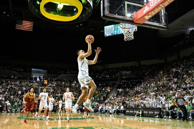 Mar 1, 2025; Eugene, Oregon, USA; Oregon Ducks guard Jackson Shelstad (3) drives to the basket against the USC Trojans during the first half at Matthew Knight Arena. Mandatory Credit: Craig Strobeck-Imagn Images