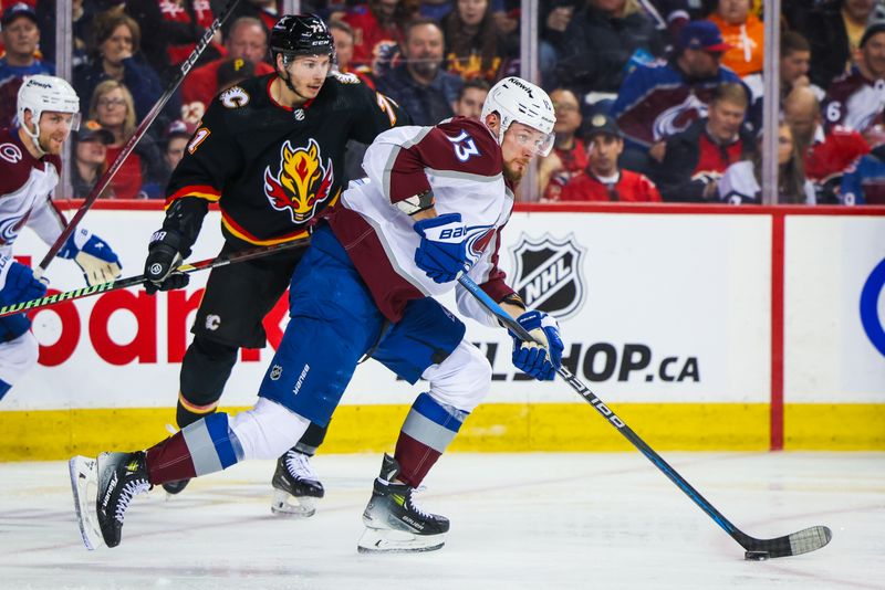 Mar 12, 2024; Calgary, Alberta, CAN; Colorado Avalanche right wing Valeri Nichushkin (13) controls the puck against the Calgary Flames during the second period at Scotiabank Saddledome. Mandatory Credit: Sergei Belski-USA TODAY Sports