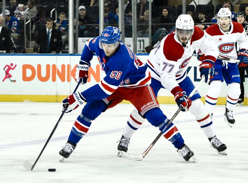 Nov 30, 2024; New York, New York, USA; New York Rangers left wing Will Cuylle (50) skates with the puck against Montreal Canadiens center Kirby Dach (77) during the third period at Madison Square Garden. Mandatory Credit: John Jones-Imagn Images