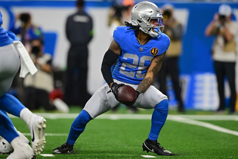 Detroit Lions running back Jahmyr Gibbs tosses the ball during the first half of an NFL football game against the Green Bay Packers, Thursday, Nov. 23, 2023, in Detroit. The Packers won 29-22. (AP Photo/David Dermer)