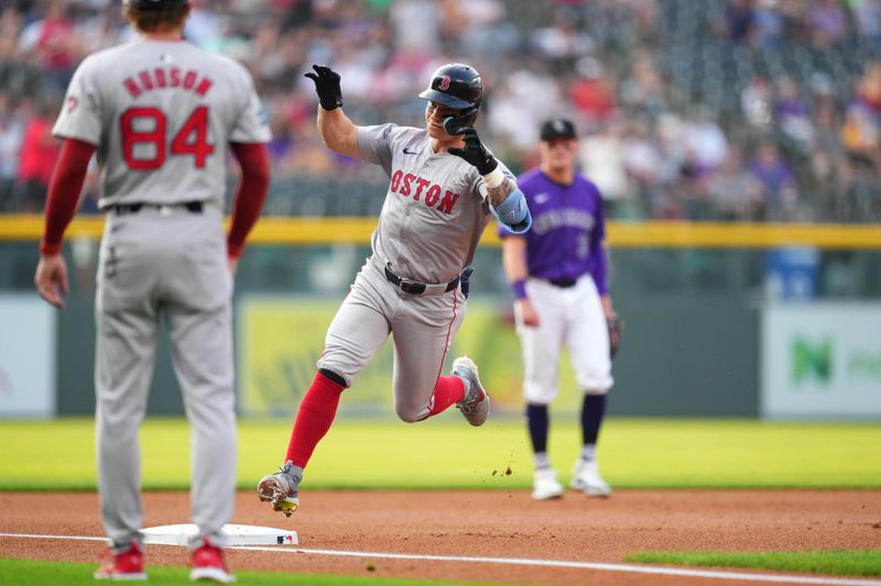 Jul 23, 2024; Denver, Colorado, USA; Boston Red Sox outfielder Tyler O'Neill (17) celebrates his two-run home run in the first inning against the Colorado Rockies at Coors Field. Mandatory Credit: Ron Chenoy-USA TODAY Sports