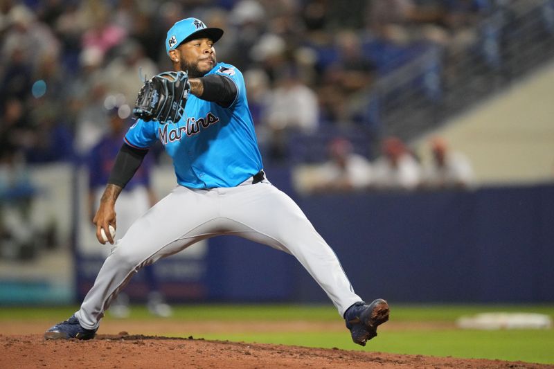 Mar 3, 2025; Port St. Lucie, Florida, USA;  Miami Marlins pitches Xzavion Curry (49) pitches in the fifth inning against the New York Mets at Clover Park. Mandatory Credit: Jim Rassol-Imagn Images