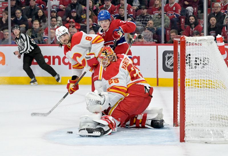 Nov 14, 2023; Montreal, Quebec, CAN; Calgary Flames goalie Jacob Markstrom (25) makes a save and Montreal Canadiens forward Cole Caufield (22) waits for the rebound during the third period at the Bell Centre. Mandatory Credit: Eric Bolte-USA TODAY Sports