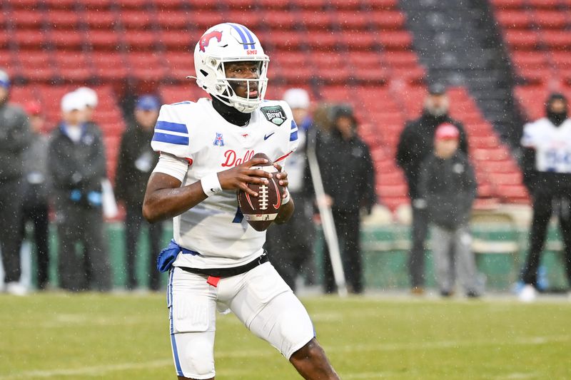 Dec 28, 2023; Boston, MA, USA; Southern Methodist Mustangs quarterback Kevin Jennings (7) drops back to pass against the Boston College Eagles during the first half at Fenway Park. Mandatory Credit: Eric Canha-USA TODAY Sports