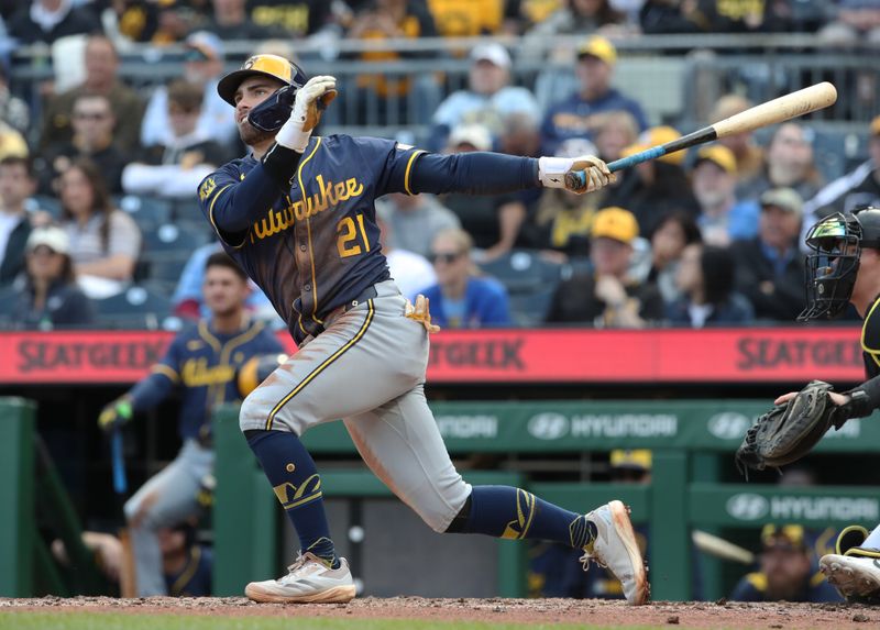 May 24, 2025; Pittsburgh, Pennsylvania, USA;  Milwaukee Brewers third baseman Caleb Durbin (21) hits a single against the Pittsburgh Pirates during the seventh inning at PNC Park. Mandatory Credit: Charles LeClaire-Imagn Images