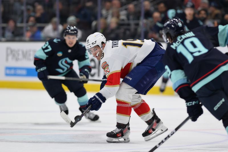 Dec 12, 2023; Seattle, Washington, USA; Florida Panthers left wing Matthew Tkachuk (19) passes the puck against the Seattle Kraken during the second period at Climate Pledge Arena. Mandatory Credit: Steven Bisig-USA TODAY Sports