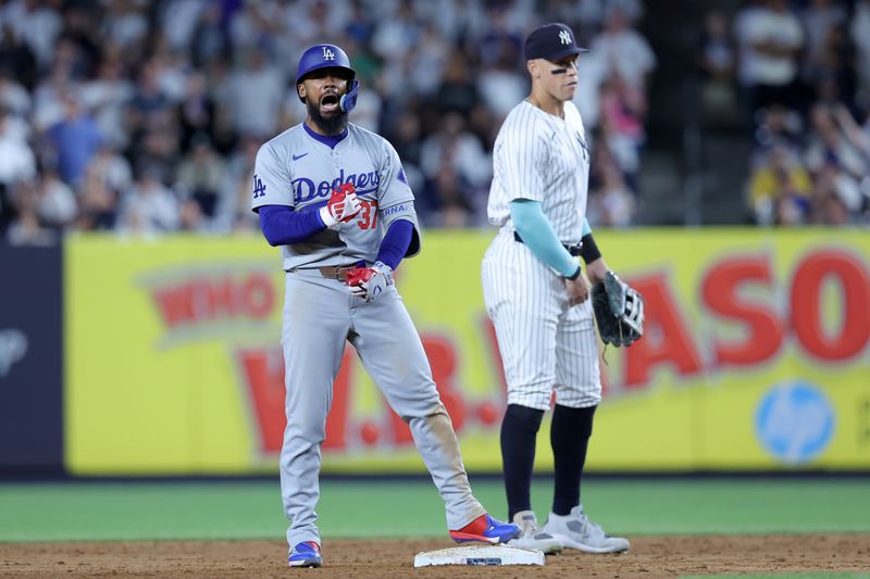 Jun 7, 2024; Bronx, New York, USA; Los Angeles Dodgers left fielder Teoscar Hernandez (37) reacts after his two run double against the New York Yankees during the eleventh inning at Yankee Stadium. Mandatory Credit: Brad Penner-USA TODAY Sports