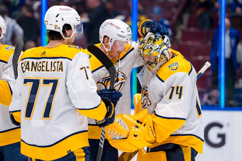 Apr 23, 2024; Vancouver, British Columbia, CAN;  Nashville Predators forward Luke Evangelista (77) and forward Gustav Nyquist (14) and goalie Juuse Saros (74) celebrate their victory against the Vancouver Canucks in game two of the first round of the 2024 Stanley Cup Playoffs at Rogers Arena. Mandatory Credit: Bob Frid-USA TODAY Sports