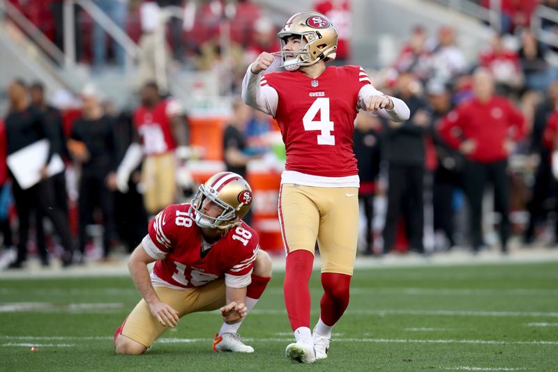 San Francisco 49ers place kicker Jake Moody (4) and holder Mitch Wishnowsky (18) watch an extra point during the NFC Championship NFL football game against the Detroit Lions in Santa Clara, Calif., Sunday, Jan. 28, 2024. (AP Photo/Scot Tucker)