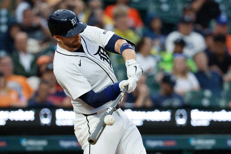 Jul 9, 2024; Detroit, Michigan, USA;  Detroit Tigers catcher Carson Kelly (15) hits a single in the sixth inning against the Cleveland Guardians at Comerica Park. Mandatory Credit: Rick Osentoski-USA TODAY Sports