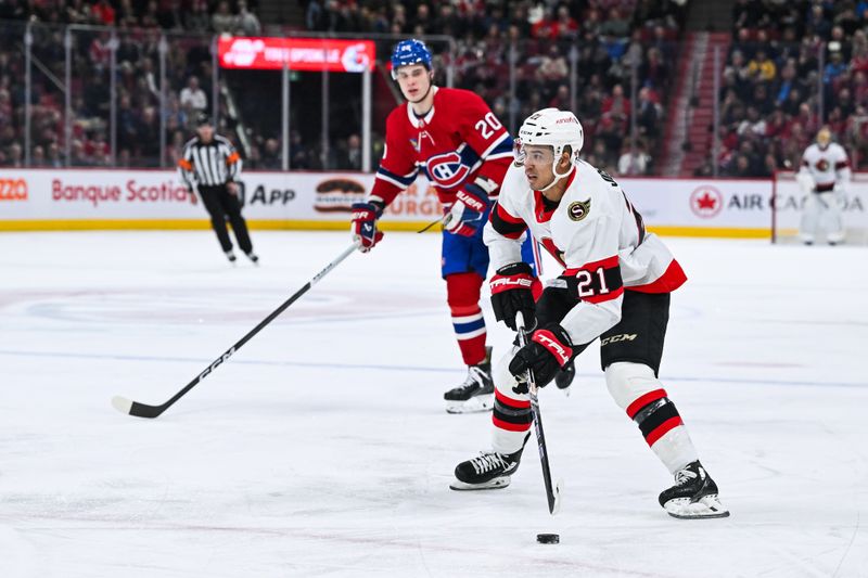 Jan 23, 2024; Montreal, Quebec, CAN; Ottawa Senators right wing Mathieu Joseph (21) plays the puck against the Montreal Canadiens during the first period at Bell Centre. Mandatory Credit: David Kirouac-USA TODAY Sports