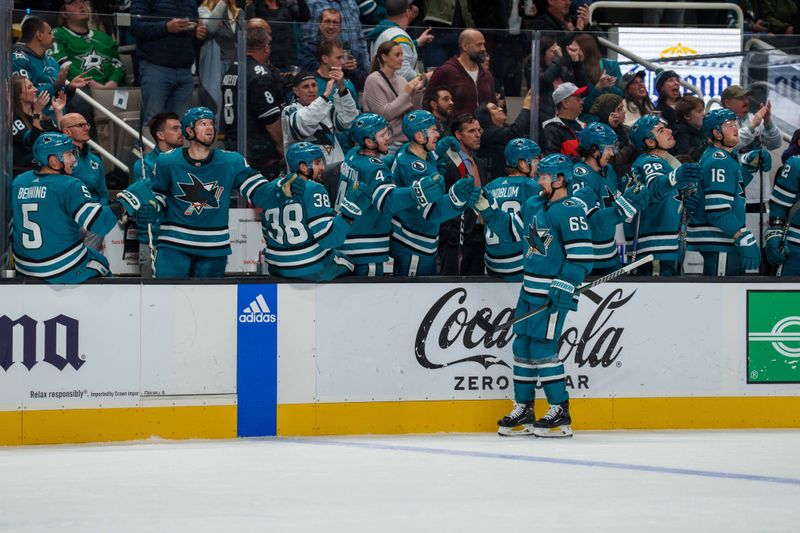 Jan 18, 2023; San Jose, California, USA;  San Jose Sharks defenseman Erik Karlsson (65) celebrates after a goal with teammates during the third period against the Dallas Stars at SAP Center at San Jose. Mandatory Credit: Neville E. Guard-USA TODAY Sports