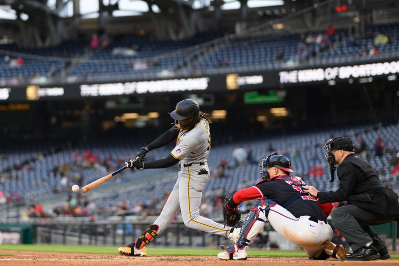 Apr 4, 2024; Washington, District of Columbia, USA; Pittsburgh Pirates shortstop Oneil Cruz (15) hits a single during the first inning against the Washington Nationals at Nationals Park. Mandatory Credit: Reggie Hildred-USA TODAY Sports