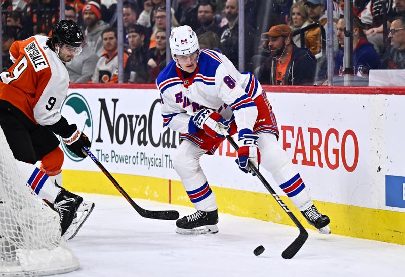 Feb 24, 2024; Philadelphia, Pennsylvania, USA; New York Rangers defenseman Jacob Trouba (8) reaches for the puck against New York Rangers center Adam Edstrom (84) in the second period at Wells Fargo Center. Mandatory Credit: Kyle Ross-USA TODAY Sports