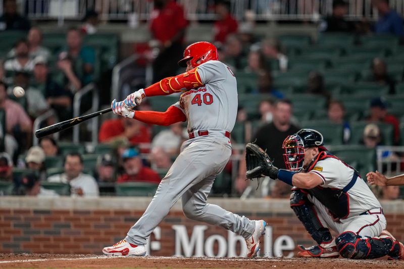 Sep 6, 2023; Cumberland, Georgia, USA; St. Louis Cardinals catcher Willson Contreras (40) hits a home run against the Atlanta Braves during the seventh inning at Truist Park. Mandatory Credit: Dale Zanine-USA TODAY Sports