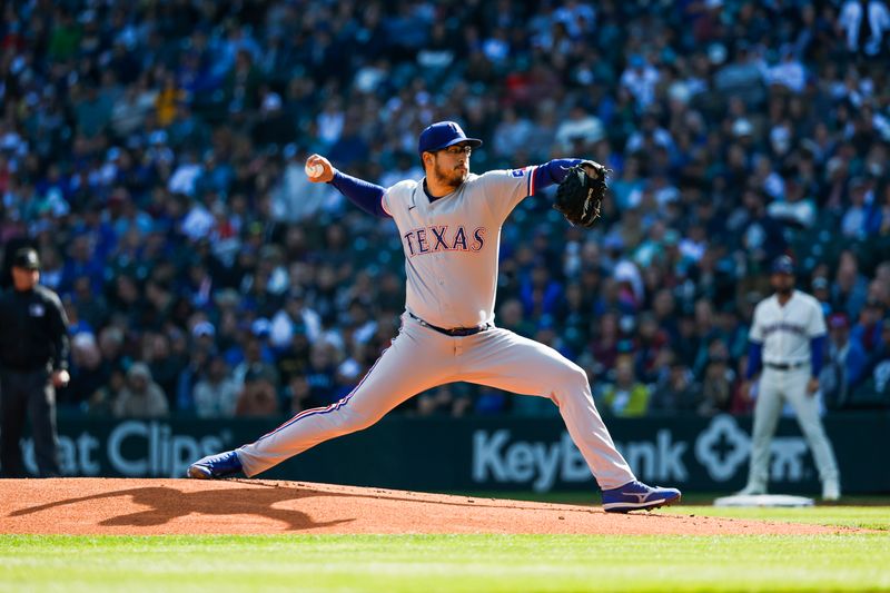 Oct 1, 2023; Seattle, Washington, USA; Texas Rangers starting pitcher Dane Dunning (33) throws against the Seattle Mariners during the first inning at T-Mobile Park. Mandatory Credit: Joe Nicholson-USA TODAY Sports