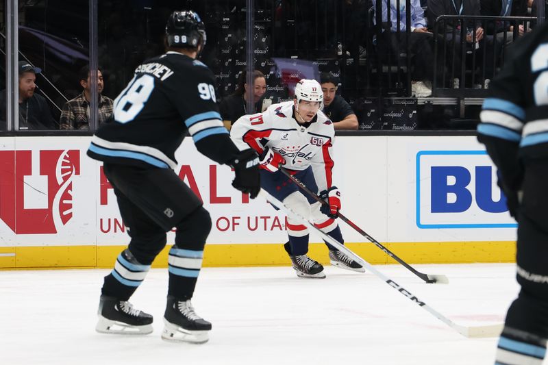 Nov 18, 2024; Salt Lake City, Utah, USA; Washington Capitals center Dylan Strome (17) sets up a play against the Utah Hockey Club during the first period at Delta Center. Mandatory Credit: Rob Gray-Imagn Images