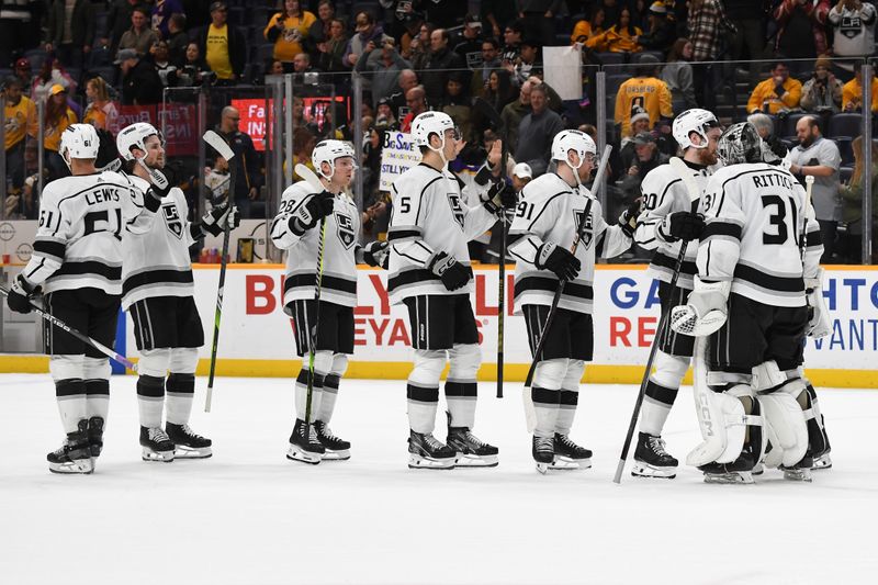 Jan 31, 2024; Nashville, Tennessee, USA; Los Angeles Kings players celebrate after a win against the Nashville Predators at Bridgestone Arena. Mandatory Credit: Christopher Hanewinckel-USA TODAY Sports