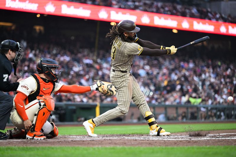 Jun 4, 2025; San Francisco, California, USA; San Diego Padres right fielder Fernando Tatis Jr. (23) hits a single against the San Francisco Giants in the fifth inning at Oracle Park. Mandatory Credit: Eakin Howard-Imagn Images