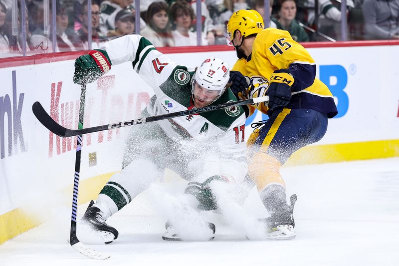 Nov 30, 2024; Saint Paul, Minnesota, USA; Minnesota Wild left wing Marcus Foligno (17) and Nashville Predators defenseman Alexandre Carrier (45) compete for the puck during the second period at Xcel Energy Center. Mandatory Credit: Matt Krohn-Imagn Images