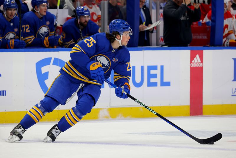 Oct 19, 2023; Buffalo, New York, USA;  Buffalo Sabres defenseman Owen Power (25) skates with the puck during the first period against the Calgary Flames at KeyBank Center. Mandatory Credit: Timothy T. Ludwig-USA TODAY Sports