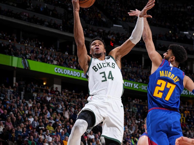 DENVER, CO - MARCH 25: Giannis Antetokounmpo #34 of the Milwaukee Bucks drives to the basket during the game against the Denver Nuggets on March 25, 2023 at the Ball Arena in Denver, Colorado. NOTE TO USER: User expressly acknowledges and agrees that, by downloading and/or using this Photograph, user is consenting to the terms and conditions of the Getty Images License Agreement. Mandatory Copyright Notice: Copyright 2023 NBAE (Photo by Garrett Ellwood/NBAE via Getty Images)