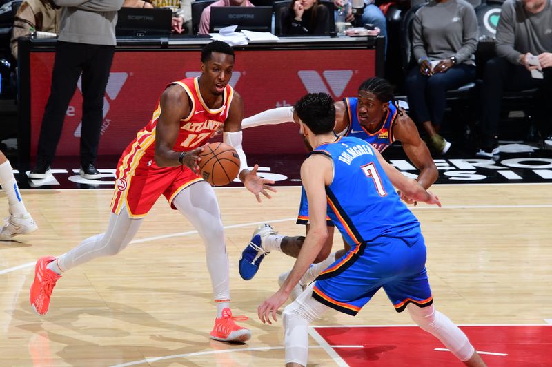 ATLANTA, GA - JANUARY 3: Onyeka Okongwu #17 of the Atlanta Hawks handles the ball during the game against the Oklahoma City Thunder on January 3, 2024 at State Farm Arena in Atlanta, Georgia.  NOTE TO USER: User expressly acknowledges and agrees that, by downloading and/or using this Photograph, user is consenting to the terms and conditions of the Getty Images License Agreement. Mandatory Copyright Notice: Copyright 2024 NBAE (Photo by Scott Cunningham/NBAE via Getty Images)