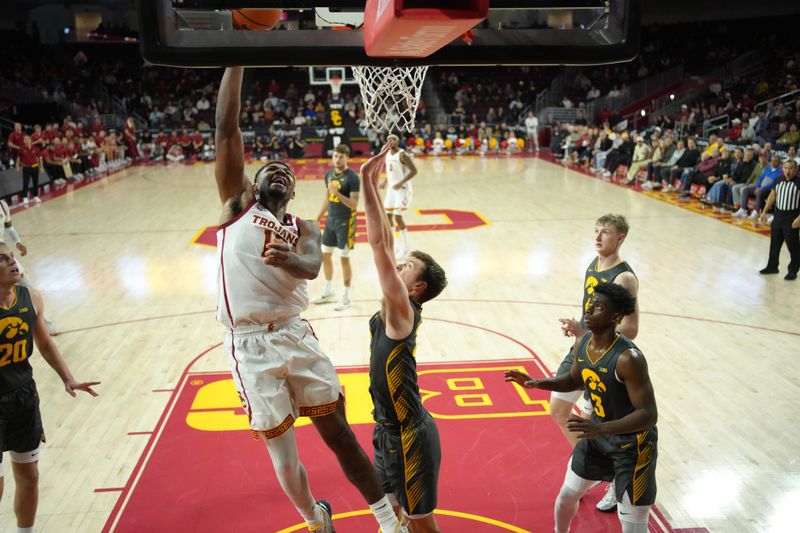 Jan 14, 2025; Los Angeles, California, USA; Southern California Trojans forward Rashaun Agee (12) shoots the ball against the Iowa Hawkeyes in the first half at Galen Center. Mandatory Credit: Kirby Lee-Imagn Images