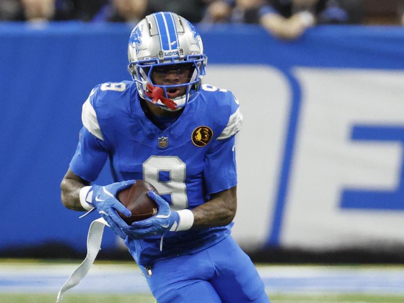 Detroit Lions wide receiver Jameson Williams (9) runs the ball against the Chicago Bears in the first half of an NFL football game in Detroit, Thursday, Nov. 28, 2024. (AP Photo/Rick Osentoski)